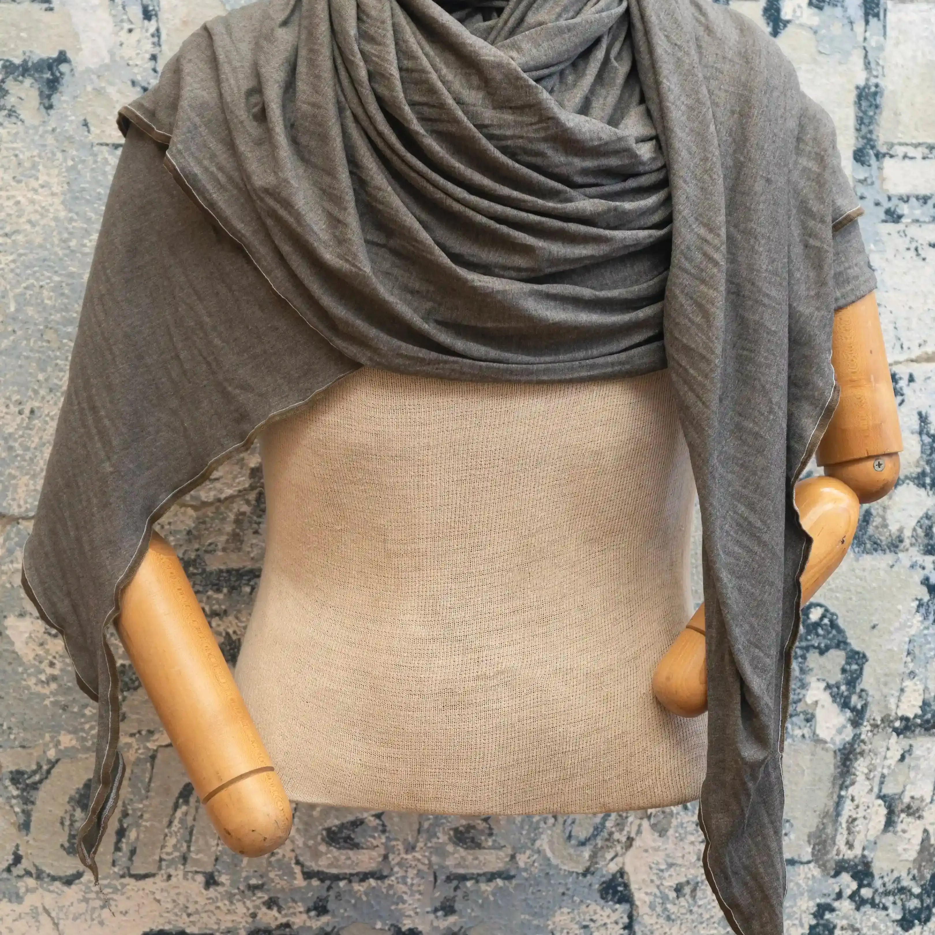 Soft hand-cut scarf showing fabric weave and craftsmanship