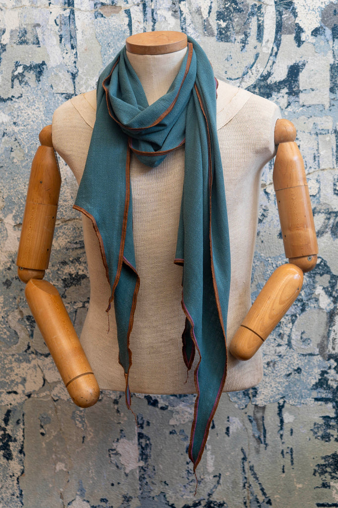 Close-up detail of linen fabric weave in the Teal Linen Scarf