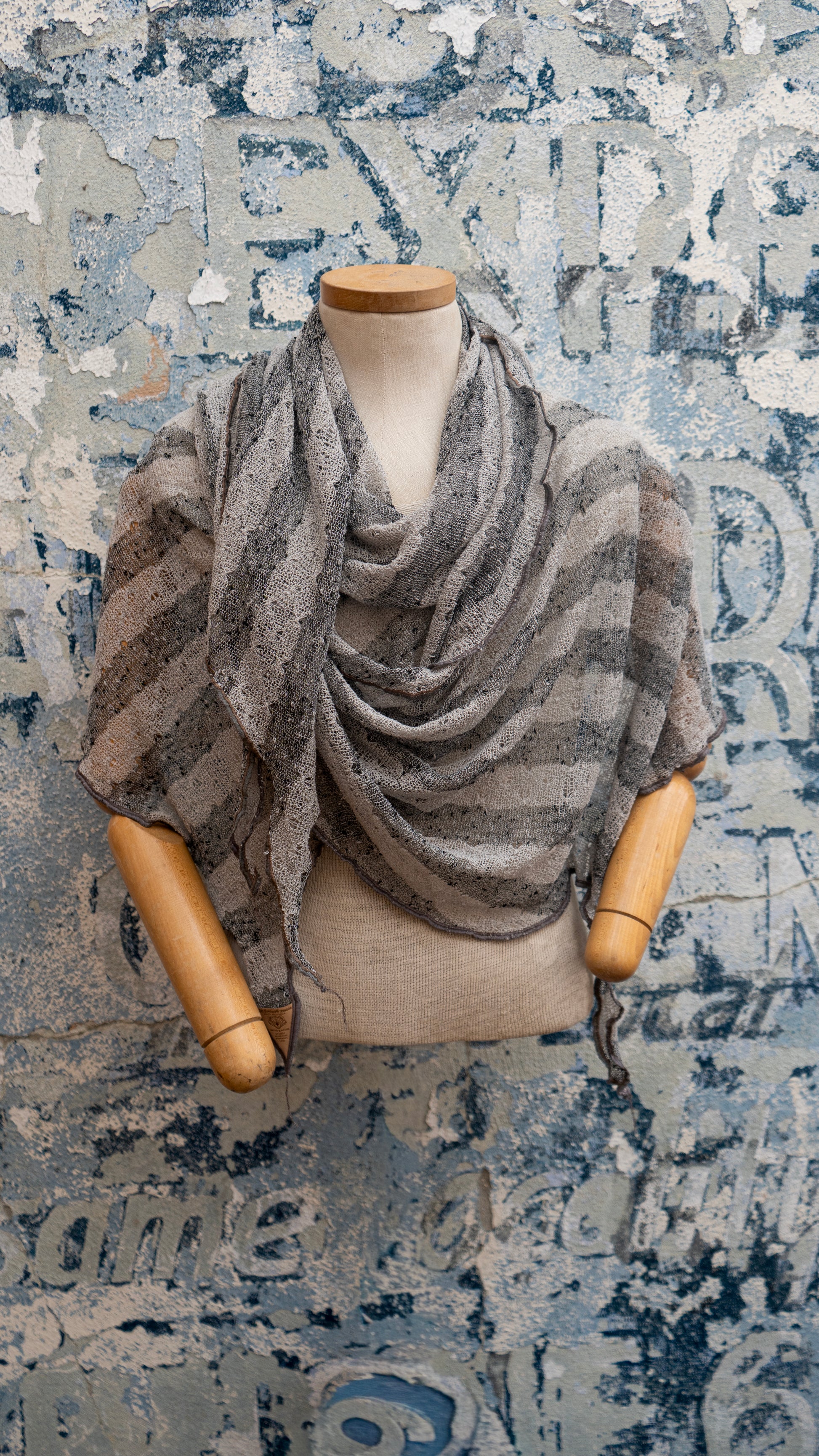 Silver Sands Shawl, a shaped shawl with side arm slits that drapes over the shoulders