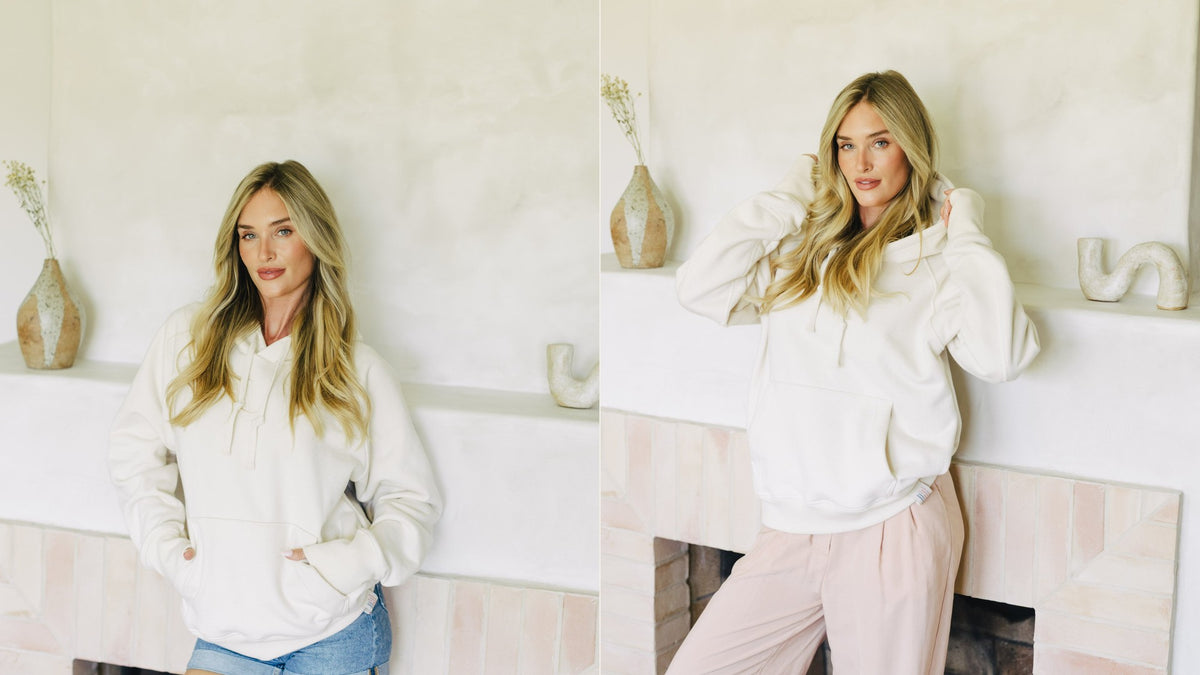 Apollo X in cream, worn at home by the fireplace